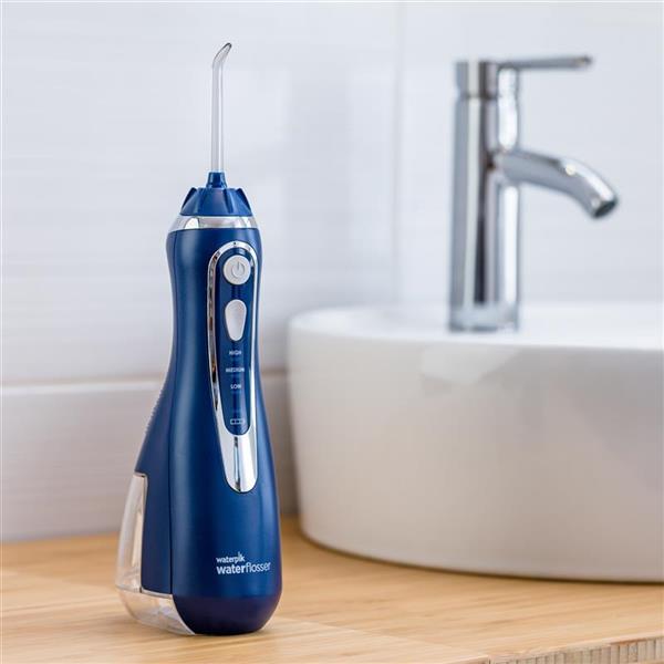 blue-cordless-advanced-water-flosser-wp-563-in-bathroom